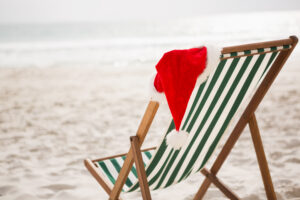 Santa Hat Kept On Empty Beach Chair