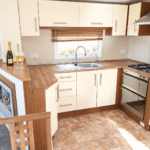 Champagne And Flutes In A Bright Kitchen