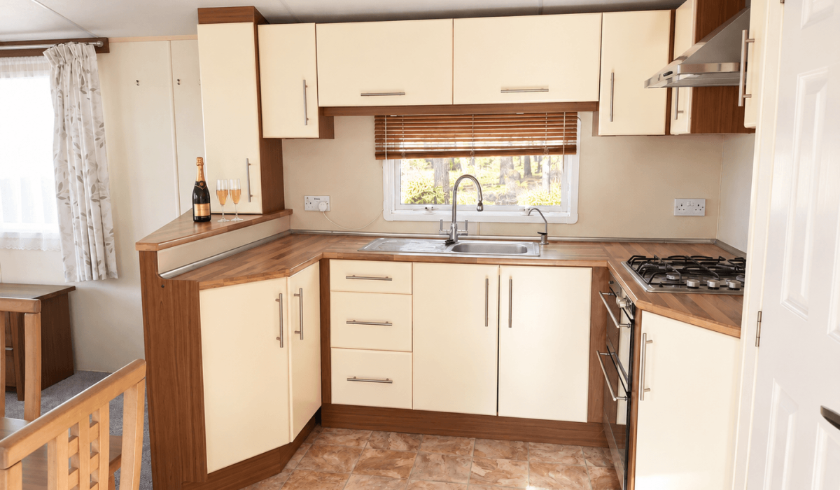 Champagne On A Sunlit Cream Kitchen Counter